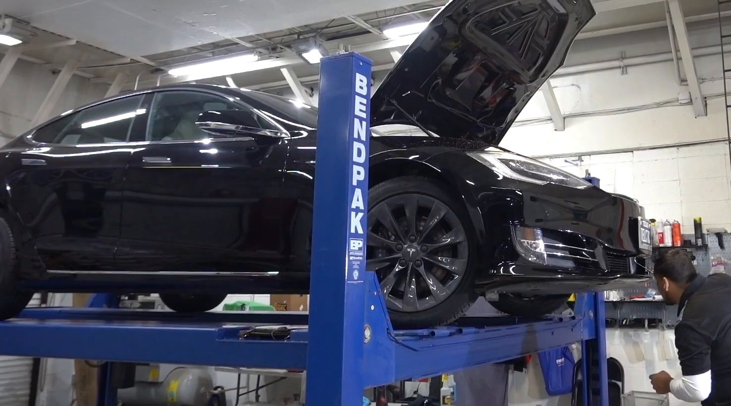 Tesla Model S on the lift for collision repair at EVS Motors