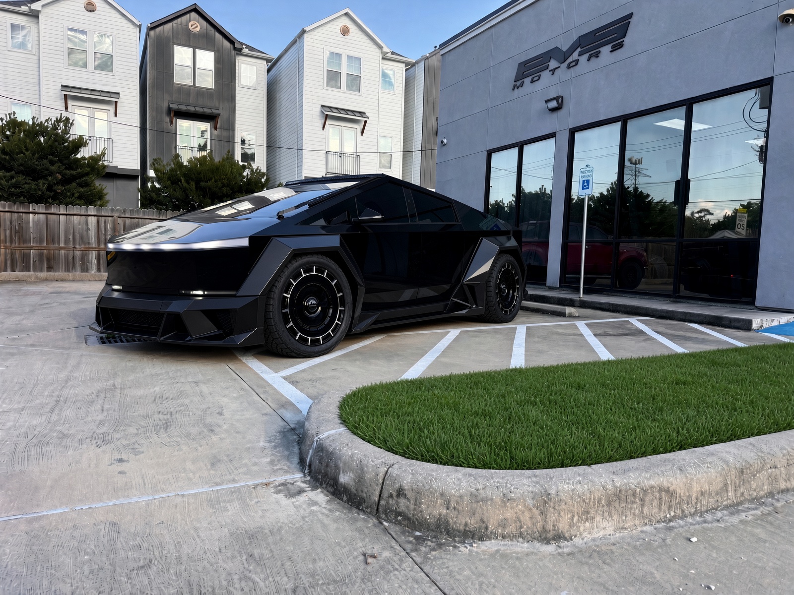 Blacked-out custom Cybertruck parked outside the EVS Motors shop in Houston